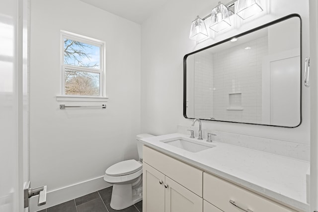 bathroom featuring a shower, tile patterned flooring, vanity, and toilet