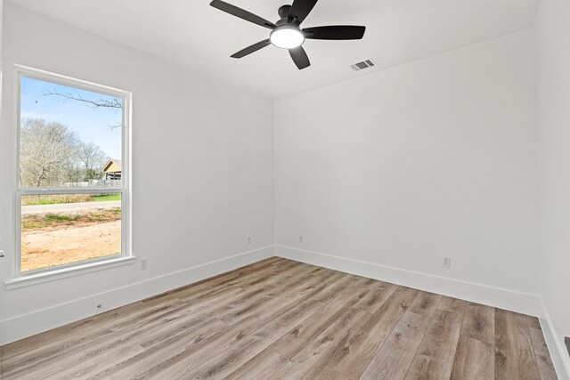 unfurnished room featuring ceiling fan and light hardwood / wood-style flooring