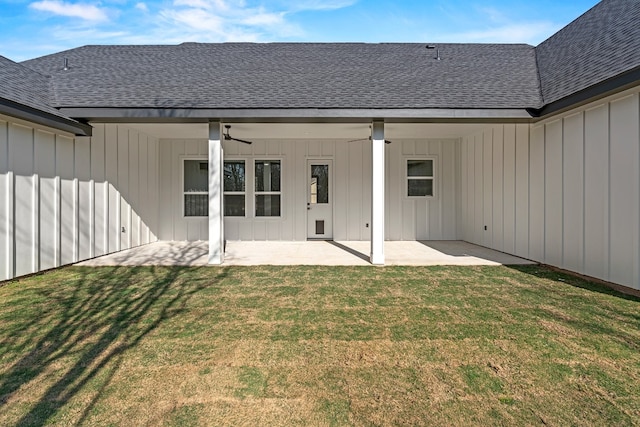 back of house with ceiling fan, a yard, and a patio