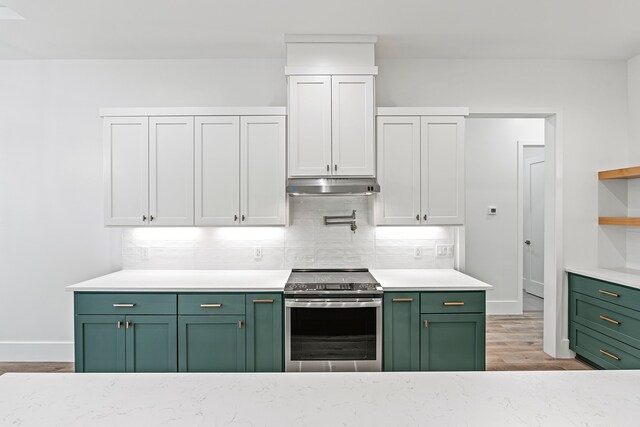 kitchen featuring white cabinetry, electric stove, and green cabinetry