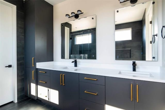 bathroom with tile patterned floors and vanity