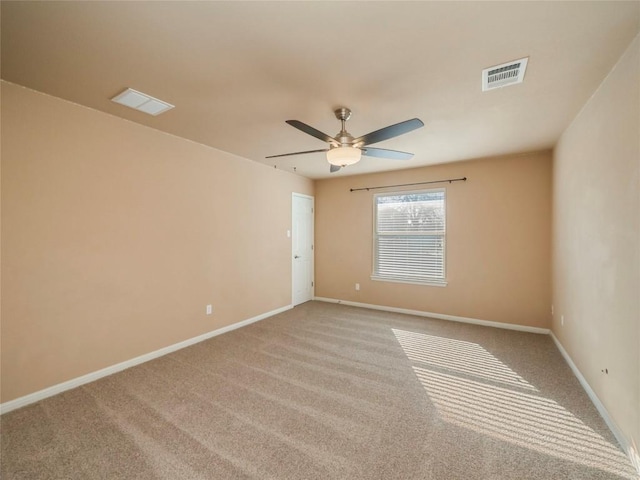 empty room with carpet floors and ceiling fan