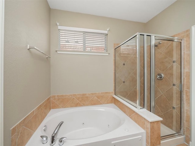 bathroom featuring shower with separate bathtub