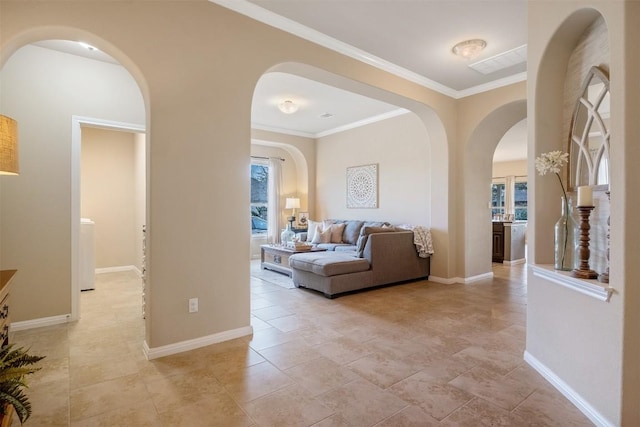 interior space with a wealth of natural light and crown molding