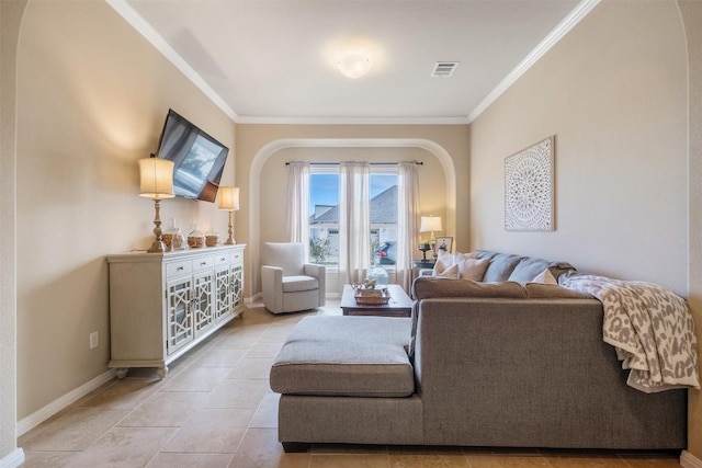 living room featuring light tile patterned flooring and ornamental molding