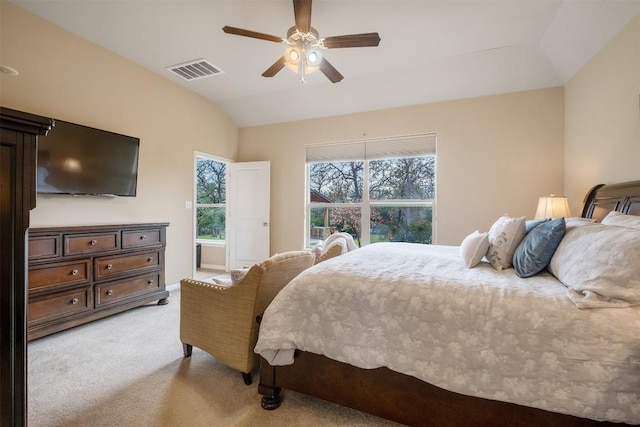 bedroom with vaulted ceiling, light colored carpet, and ceiling fan