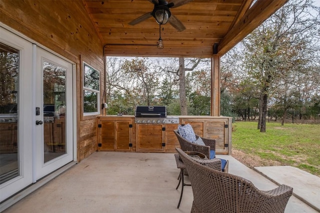 exterior space featuring lofted ceiling, sink, ceiling fan, and wood ceiling