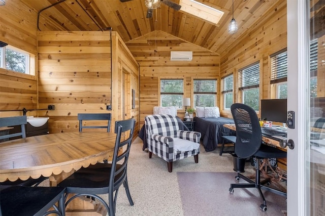 office space with lofted ceiling with skylight, a wall unit AC, wood walls, ceiling fan, and wooden ceiling