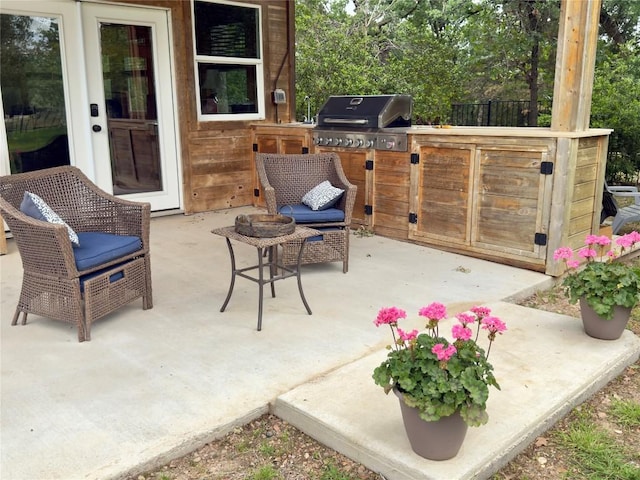 view of patio with an outdoor kitchen and area for grilling