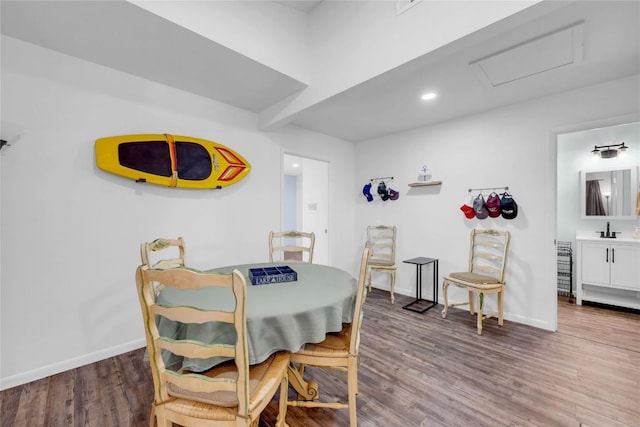 dining room featuring sink and dark hardwood / wood-style floors