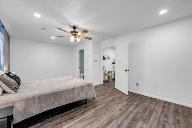 bedroom with ceiling fan and dark hardwood / wood-style flooring