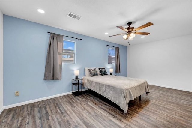 bedroom with ceiling fan and wood-type flooring