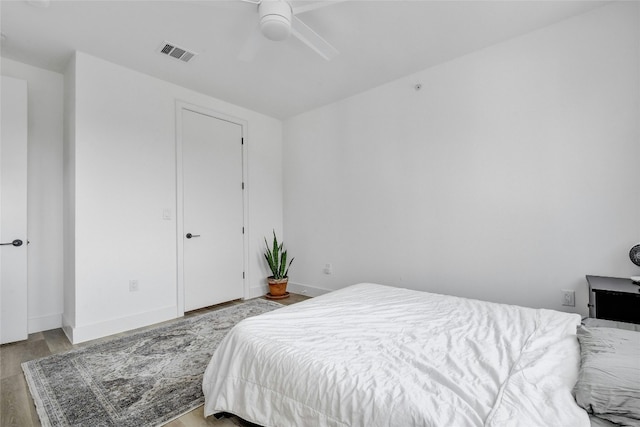 bedroom with light wood-type flooring and ceiling fan