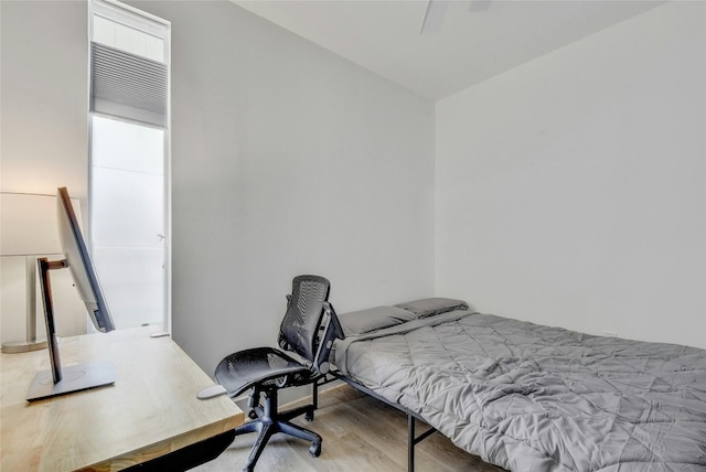 bedroom featuring ceiling fan and wood-type flooring