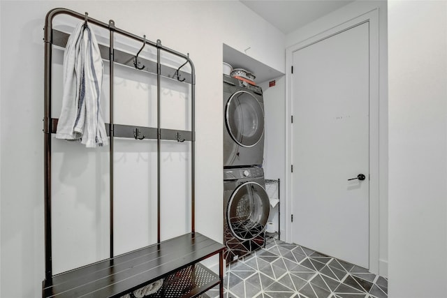 laundry area with stacked washer and dryer