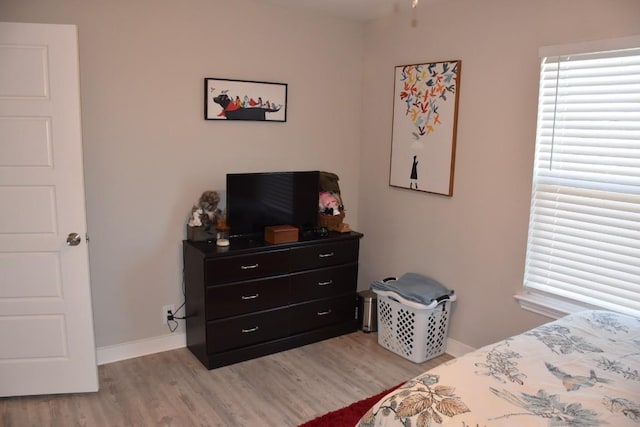 bedroom with light hardwood / wood-style floors