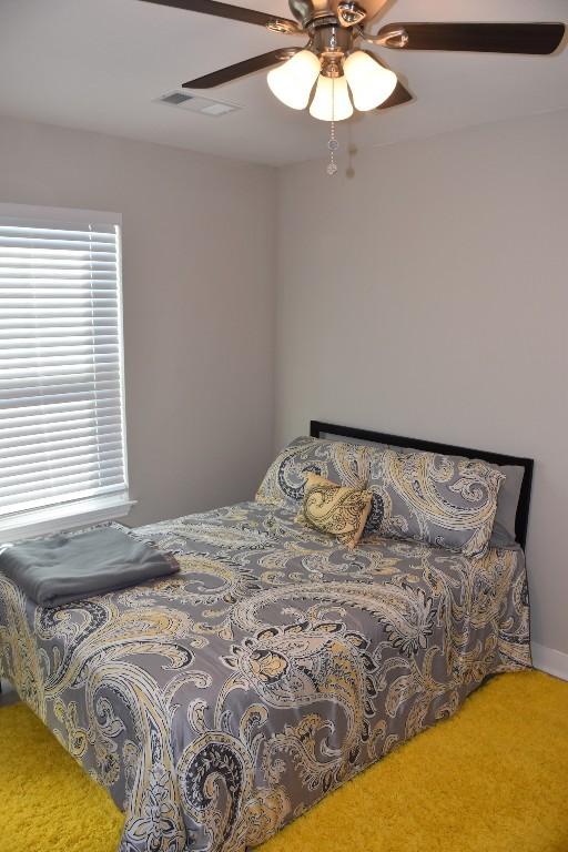 bedroom with carpet and ceiling fan