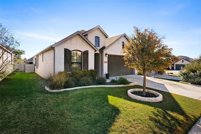 french country inspired facade featuring a garage and a front yard