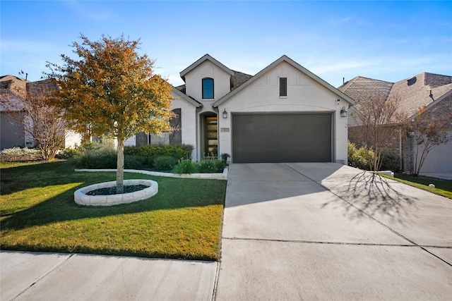 view of front of home featuring a front yard and a garage