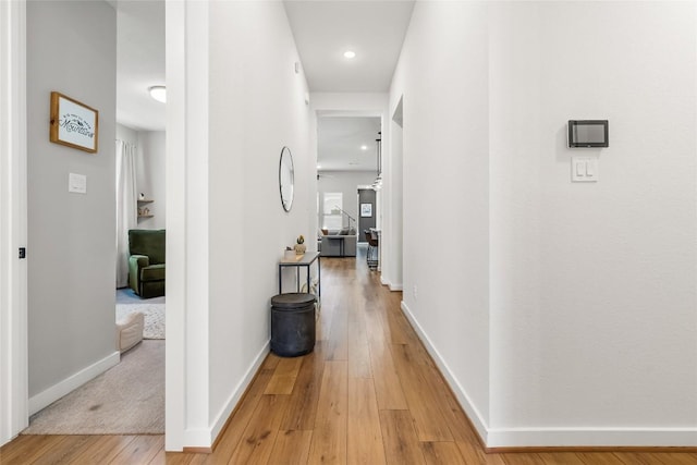 hallway featuring wood-type flooring