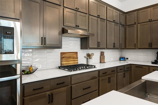 kitchen featuring backsplash and stainless steel appliances