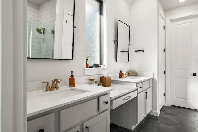 bathroom featuring tile patterned flooring, vanity, and a shower with shower door