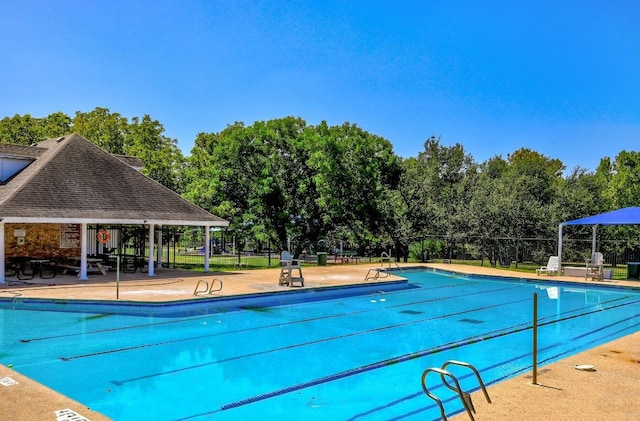 16046 Stoneham Cir, Pflugerville, TX 78660 - community pool featuring view of scattered trees and a patio