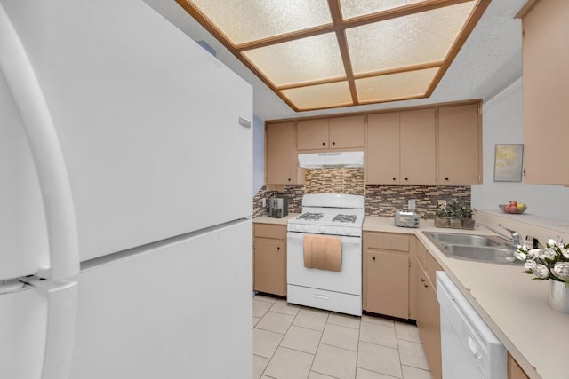 16046 Stoneham Cir, Pflugerville, TX 78660 - kitchen with white appliances, under cabinet range hood, light countertops, and a sink