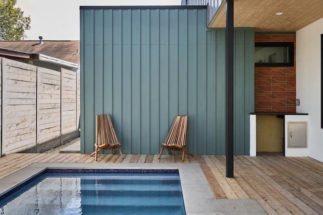 exterior space with a pool side deck