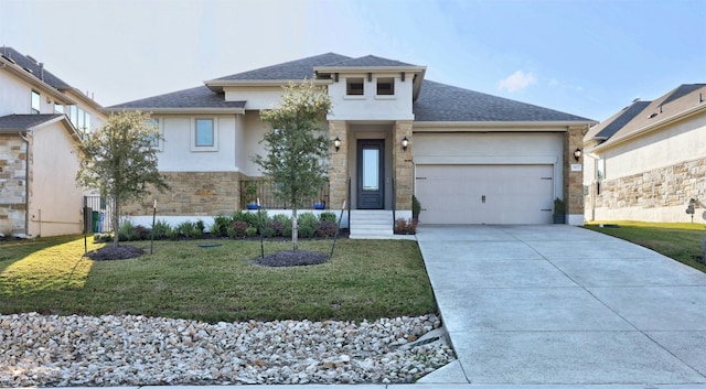 view of front of property featuring a garage and a front yard