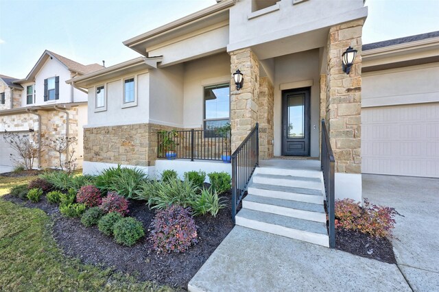 doorway to property with a garage