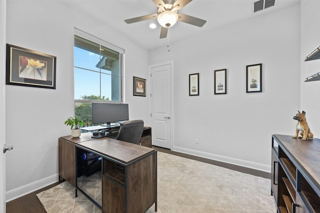 office area with light hardwood / wood-style floors and ceiling fan