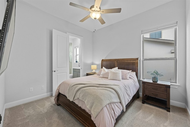 carpeted bedroom with connected bathroom and ceiling fan