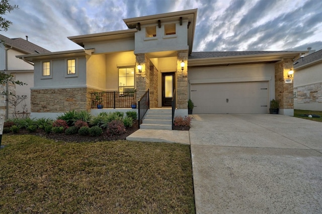 view of front of home featuring a porch and a garage