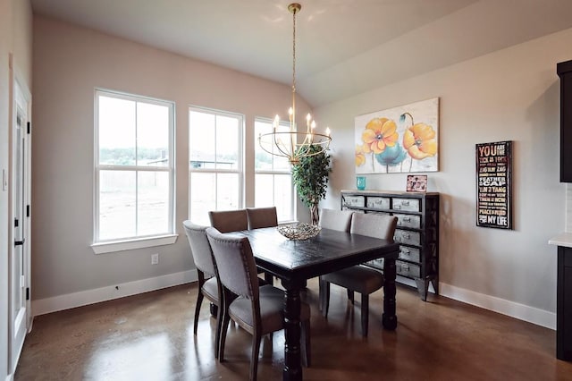 dining area featuring vaulted ceiling and a notable chandelier