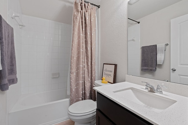 full bathroom featuring vanity, shower / bath combo, and toilet