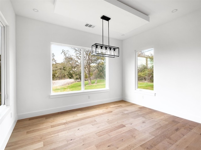 unfurnished dining area with light hardwood / wood-style flooring