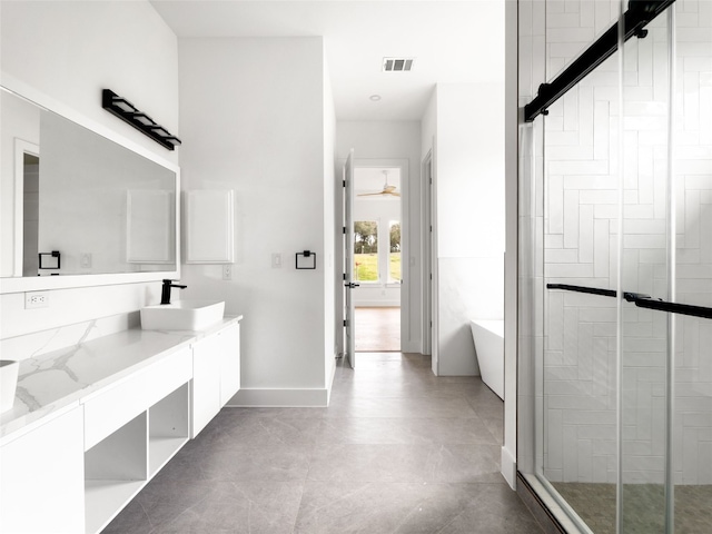 bathroom featuring vanity and separate shower and tub