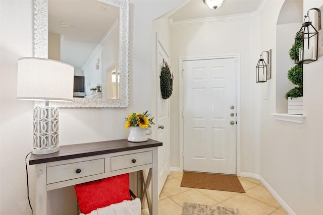 tiled foyer with ornamental molding