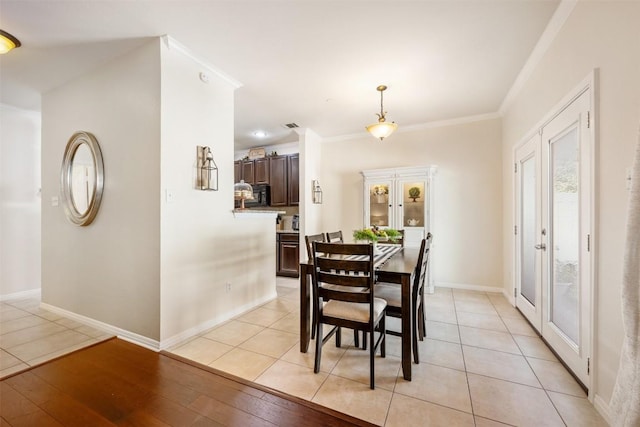 tiled dining room with crown molding