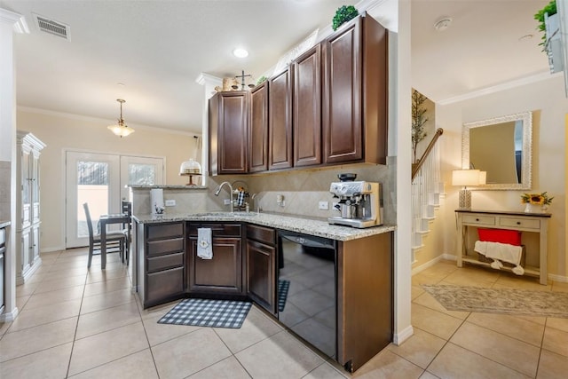 kitchen featuring hanging light fixtures, black dishwasher, light stone counters, light tile patterned floors, and ornamental molding