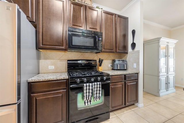 kitchen featuring black appliances, dark brown cabinets, light tile patterned floors, and ornamental molding