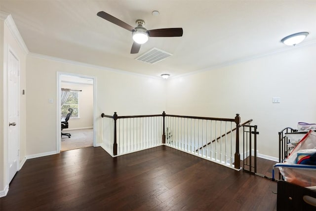 hall with crown molding and dark wood-type flooring