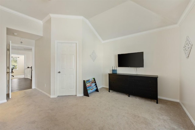 bedroom with light carpet, vaulted ceiling, and ornamental molding