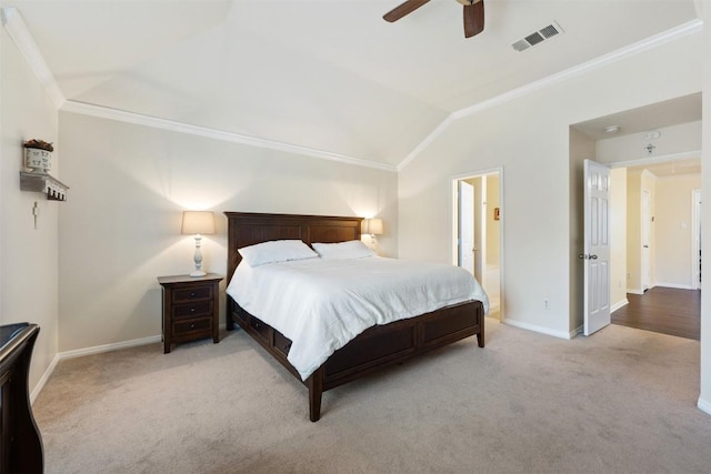 bedroom with light colored carpet, ceiling fan, ornamental molding, and ensuite bathroom