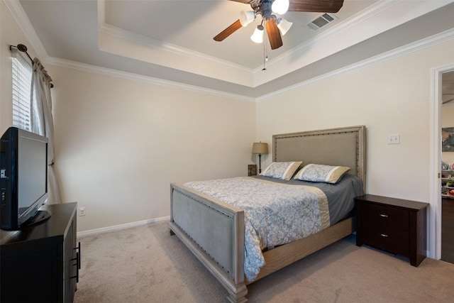 carpeted bedroom featuring a raised ceiling, ceiling fan, and ornamental molding