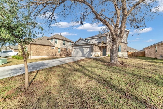 view of front of home featuring a front yard and a garage