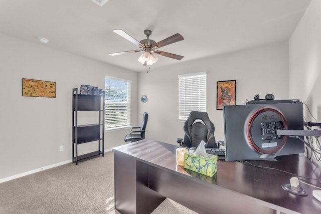 carpeted office featuring ceiling fan