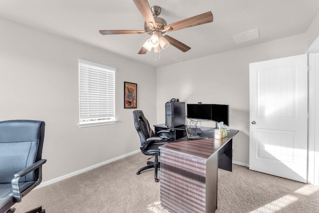 home office with ceiling fan and light colored carpet