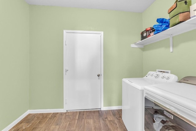 washroom featuring washer and dryer and hardwood / wood-style flooring